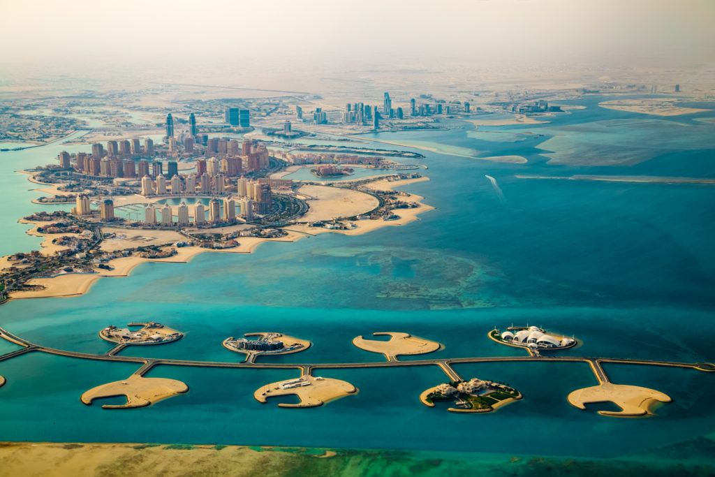 An aerial view as seen from a helicopter ride of the capital city of Qatar, Doha, in the Middle East! This is an exciting tour to enjoy on a Sky Bird Travel & Tours vacation of a top travel destination.