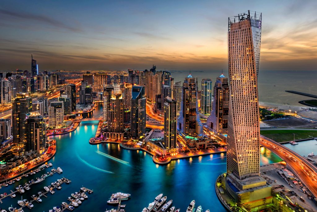 This Image of the Dubai city skyline is featured in the Sky Bird Travel & Tours tour blog best honeymoon destinations, which lists the most romantic locations for newlyweds and couples.
