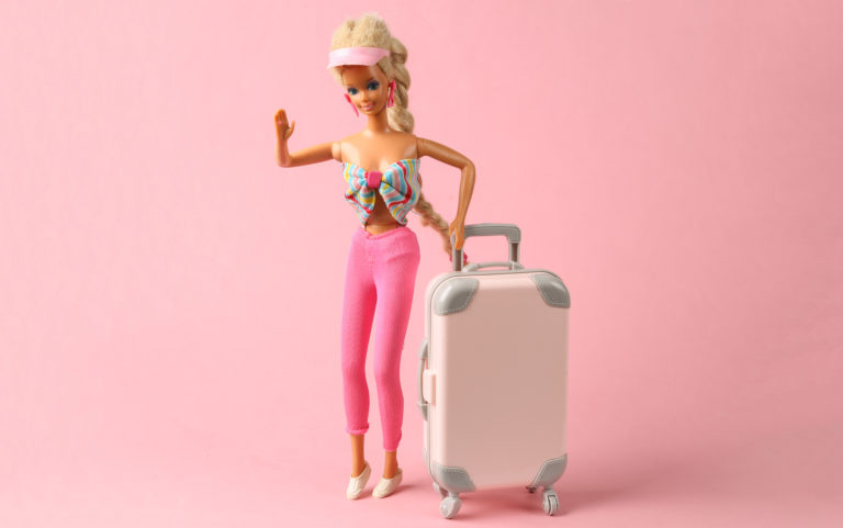 This image featured in sky bird blog "On Location: Barbie" shows Barbie doll in fur coat and shoes with luggage