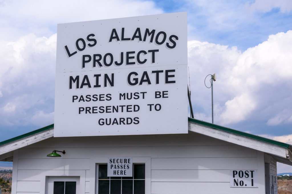 This image featured in Sky Bird blog "On Location: Oppenheimer" Los Alamos Project Main Gate sign on historic building - Los Alamos, New Mexico