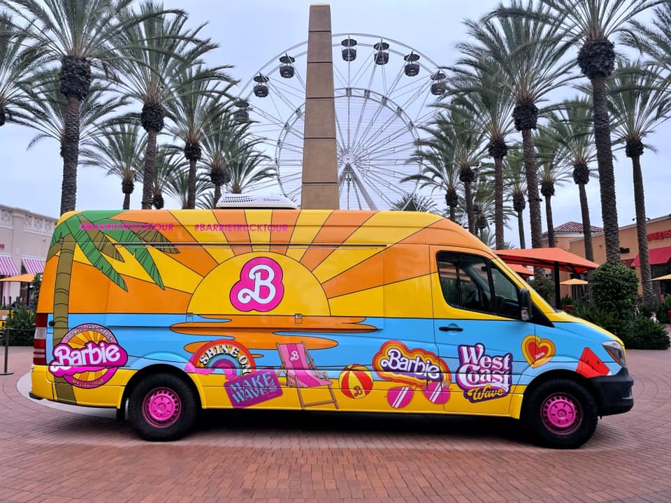 Featured in On Location: Barbie by Sky Bird Travel & Tours, this image shows the Barbie truck tour which sells merch for the movie.