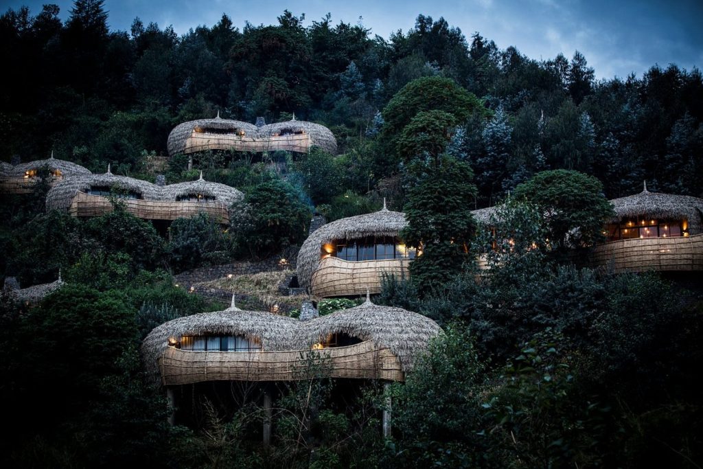 Featured in Top Luxury Retreats for 2023 by Sky Bird Travel & Tours, this image shows the jungle villas at Wilderness Bisate Lodge in Rwanda, Africa.