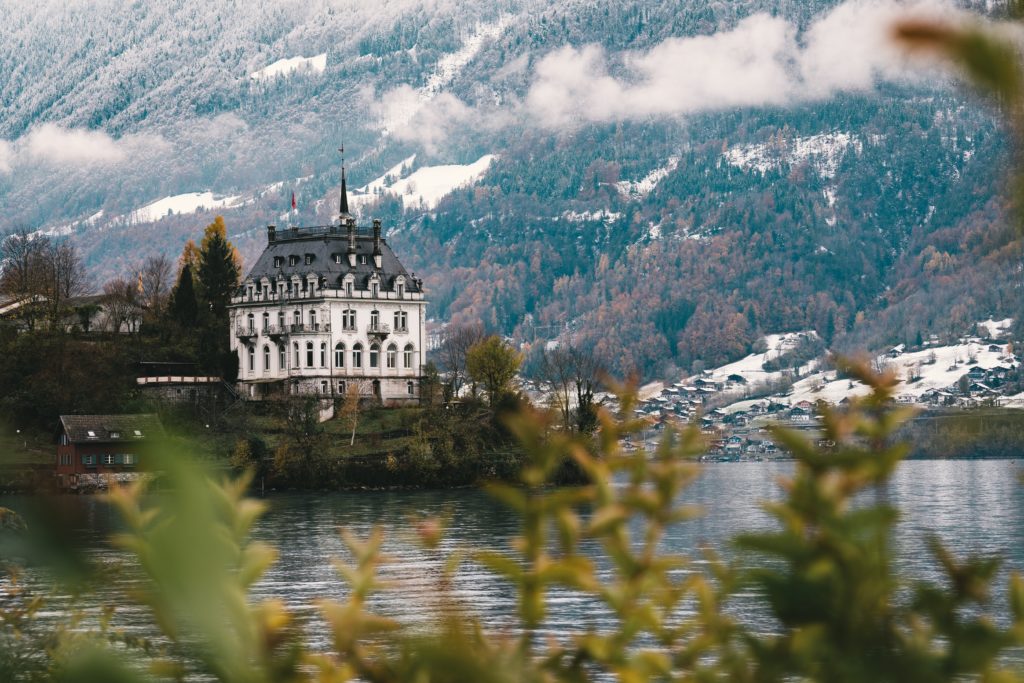 Featured in 2023 Winter Vacation Destinations from Sky Bird Travel & Tours, this image shows a rustic castle in Interlaken, Switzerland.