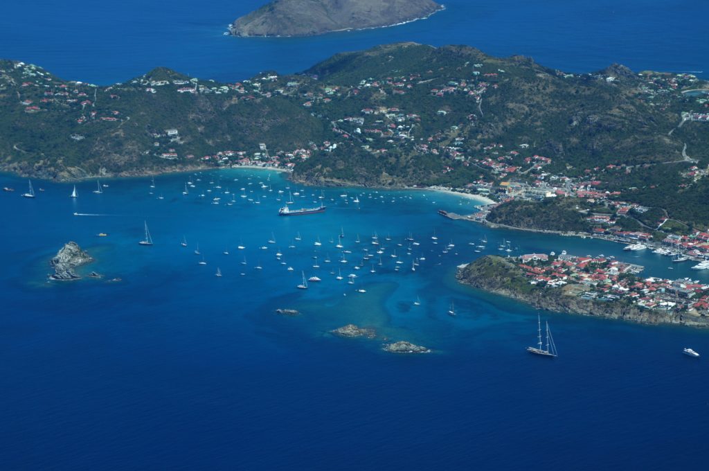 Featured in 2023 Winter Vacation Destinations from Sky Bird Travel & Tours, this image shows a wide shot of the island Nevis in the Caribbean.