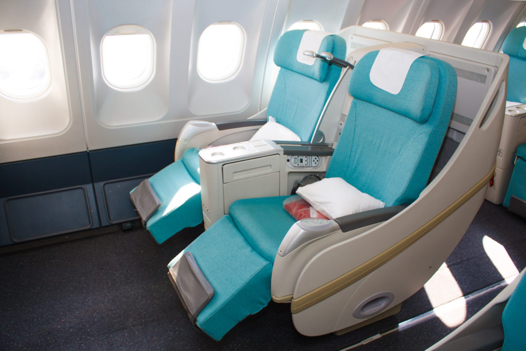 Featured in Understanding Flight Classes from Sky Bird Travel & Tours, this image shows the spacious business class cabin.