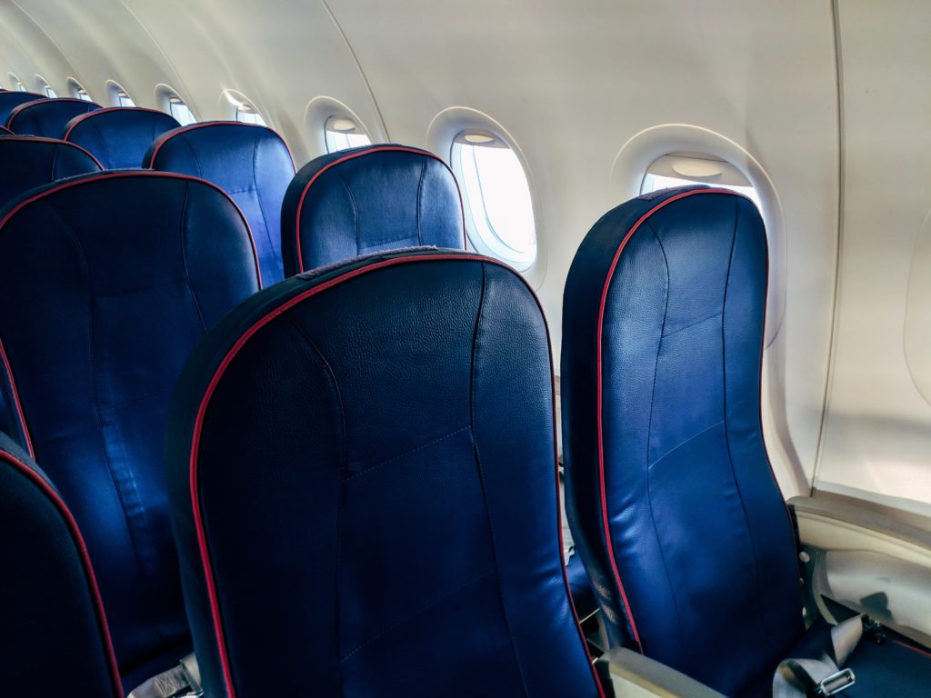Featured in Understanding Flight Classes by Sky Bird Travel & Tours, this image shows the airline seats in premium economy class.