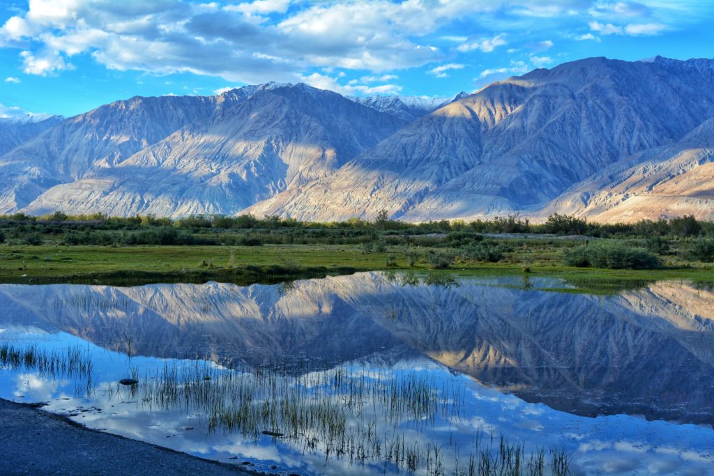 Featured in Top 10 Indian Cities by Sky Bird Travel & Tours, this image shows Leh Lake in Ladak, India.