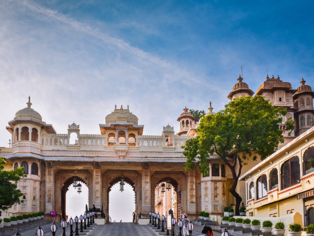 Featured in Top 10 Indian Cities by Sky Bird Travel & Tours, this image shows the old city palace in Rajasthan, India.