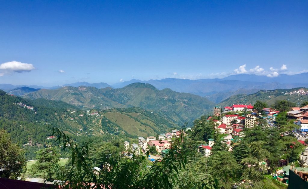 Featured in Top 10 Indian Cities by Sky Bird Travel & Tours, this image shows the mountain towns of Shimla, India.