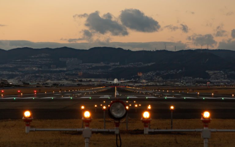 This image featured in sky bird travel & tours blog "A GUIDE TO CHOOSING THE RIGHT AIRLINE CONSOLIDATOR".it is showing a plane on the runway.